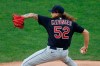 Cleveland Indians pitcher Mike Clevinger throws against the Minnesota Twins in the first inning of a baseball game Friday, July 31, 2020, in Minneapolis. (AP Photo/Jim Mone)