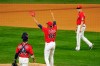 Minnesota Twins first baseman Alex Kirilloff, right, watches Twins' relief pitcher Jorge Alcala (66) celebrate after they defeated the Kansas City Royals in a baseball game, Friday, April 30, 2021, in Minneapolis. (AP Photo/Jim Mone)