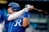 Kansas City Royals' Hunter Dozier bats during the first inning of an exhibition baseball game against the Houston Astros in Kansas City, Mo., Monday, July 20, 2020. (AP Photo/Charlie Riedel)