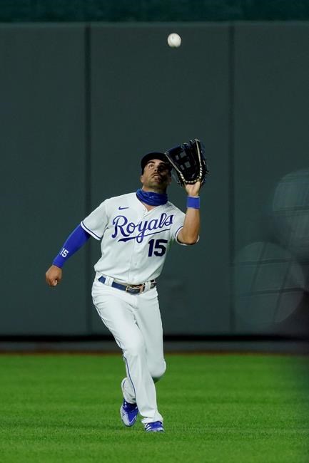 Kansas City Royals center fielder Whit Merrifield catches a fly ball for the out on Cleveland Indians' Tyler Naquin during the seventh inning of a baseball game, Monday, Aug. 31, 2020, in Kansas City, Mo. (AP Photo/Charlie Riedel)