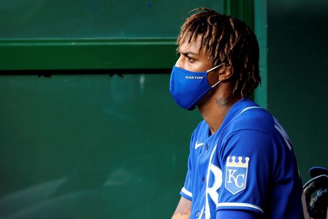 Kansas City Royals' Adalberto Mondesi sits in the dugout during an intrasquad baseball scrimmage at Kauffman Stadium on Wednesday, July 15, 2020, in Kansas City, Mo. (AP Photo/Charlie Riedel)