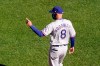 Texas Rangers manager Chris Woodward motions for a pitching change during the first inning of a baseball game against the Kansas City Royals Thursday, April 1, 2021, in Kansas City, Mo. (AP Photo/Charlie Riedel)