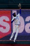 Kansas City Royals center fielder Michael A. Taylor can't catch an RBI triple by Willy Adames during the fifth inning of a baseball game Tuesday, April 20, 2021, in Kansas City, Mo. (AP Photo/Charlie Riedel)