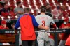 Philadelphia Phillies right fielder Bryce Harper, right, is helped off the field after getting hit by a pitch during the sixth inning of the team's baseball game against the St. Louis Cardinals on Wednesday, April 28, 2021, in St. Louis. (AP Photo/Joe Puetz)
