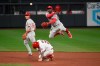 St. Louis Cardinals' Tyler O'Neill is forced out at second as Philadelphia Phillies shortstop Didi Gregorius turns a double play on Justin Williams during the sixth inning of a baseball game Wednesday, April 28, 2021, in St. Louis. (AP Photo/Joe Puetz)