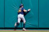 Milwaukee Brewers center fielder Avisail Garcia slams into the outfield wall after catching a fly ball by St. Louis Cardinals' Paul DeJong for an out during the second inning of a baseball game Sunday, Sept. 27, 2020, in St. Louis. (AP Photo/Jeff Roberson)