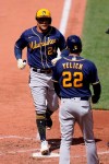 Milwaukee Brewers' Avisail Garcia (24) is congratulated by teammate Christian Yelich (22) after hitting a two-run home run during the fifth inning of a baseball game against the St. Louis Cardinals Saturday, April 10, 2021, in St. Louis. (AP Photo/Jeff Roberson)