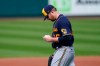 Milwaukee Brewers starting pitcher Brett Anderson looks down at his hand as he walks off the field while leaving with an injury during the third inning of a baseball game against the St. Louis Cardinals Sunday, Sept. 27, 2020, in St. Louis. (AP Photo/Jeff Roberson)