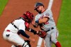 Washington Nationals' Kyle Schwarber, right, is tagged out at home by St. Louis Cardinals catcher Yadier Molina to end the top of the eighth inning of a baseball game Monday, April 12, 2021, in St. Louis. (AP Photo/Jeff Roberson)