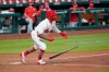 St. Louis Cardinals' Kolten Wong drops his bat after hitting a walk-off single to defeat the Cincinnati Reds in a baseball game Thursday, Aug. 20, 2020, in St. Louis. (AP Photo/Jeff Roberson)