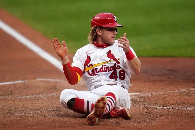 St. Louis Cardinals' Harrison Bader celebrates after scoring during the third inning in the second game of a baseball doubleheader against the Minnesota Twins Tuesday, Sept. 8, 2020, in St. Louis. (AP Photo/Jeff Roberson)
