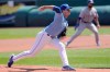 Kansas City Royals starting pitcher Brady Singer delivers to a Texas Rangers batter during the first inning of a baseball game at Kauffman Stadium in Kansas City, Mo., Sunday, April 4, 2021. (AP Photo/Orlin Wagner)