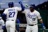Kansas City Royals Adalberto Mondesi (27) is congratulated by teammate Salvador Perez (13) after his solo home run during the fourth inning of a baseball game against the Detroit Tigers at Kauffman Stadium in Kansas City, Mo., Sunday, Sept. 27, 2020. (AP Photo/Orlin Wagner)
