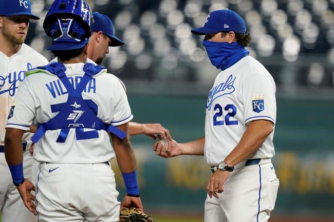 Kansas City Royals manager Mike Matheny, right, takes the ball from relief pitcher Jake Newberry during the seventh inning of a baseball game against the Chicago White Sox at Kauffman Stadium in Kansas City, Mo., Thursday, Sept. 3, 2020. (AP Photo/Orlin Wagner)