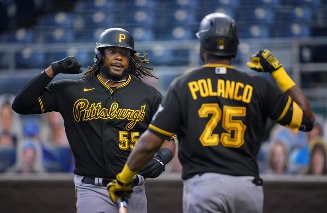 Pittsburgh Pirates' Josh Bell (55) celebrates with teammate Gregory Polanco after hitting a home run against the Kansas City Royals during the second inning of a baseball game in Kansas City, Mo., Saturday, Sept. 12, 2020. (AP Photo/Reed Hoffmann)