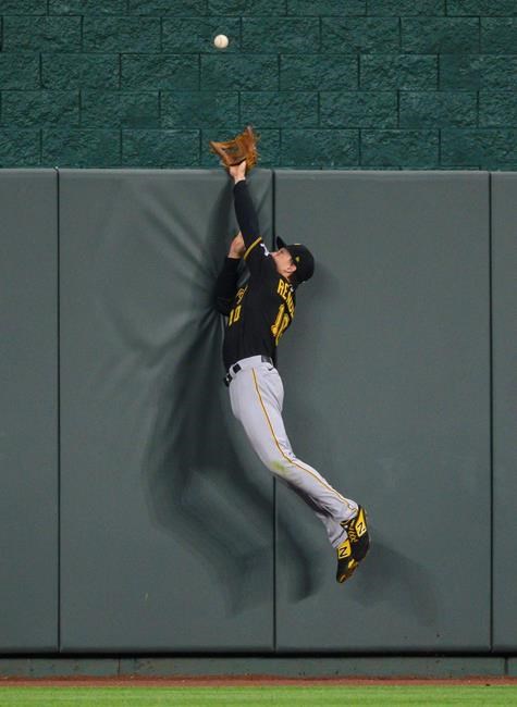 Pittsburgh Pirates center fielder Bryan Reynolds cannot reach a home run off the bat of Kansas City Royals' Adalberto Mondesi during the third inning of a baseball game in Kansas City, Mo., Saturday, Sept. 12, 2020. (AP Photo/Reed Hoffmann)