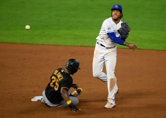 Kansas City Royals shortstop Adalberto Mondesi, right, forces out Pittsburgh Pirates' Gregory Polanco, left, and throws to first for a double play during the seventh inning of a baseball game in Kansas City, Mo., Saturday, Sept. 12, 2020. (AP Photo/Reed Hoffmann)