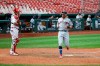 St. Louis Cardinals catcher Yadier Molina (4) watches as Cleveland Indians' Mike Freeman scores a run during the 12th inning of a baseball game, Saturday, Aug. 29, 2020, in St. Louis. (AP Photo/Scott Kane)