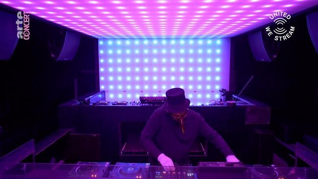 In this March 18, 2020, frame from video provided by Rundfunk Berlin-Brandenburg, DJ Claptone performs a set as part of the