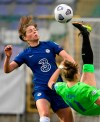 Melanie Leupolz of Chelsea, left, and Alexandra Popp of Wolfsburg in action during the UEFA Women's Champions League quarter-final soccer match Chelsea vs Vfl Wolfsburg in the Ferenc Szusza Stadium in Budapest, Hungary, Wednesday, March 24, 2021. (Zsolt Szigetvary/MTI via AP)