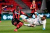 Mayron George Clayton, left, of Budapest Honved and goalkeeper Peter Szappanos of Mezokovesd Zsory FC vie for the ball during the soccer Hungarian Cup final match Budapest Honved vs Mezokovesd Zsory FC in the Puskas Ferenc Arena in Budapest, Hungary, Wednesday, June 3, 2020. (Zsolt Szigetvary/MTI via AP)