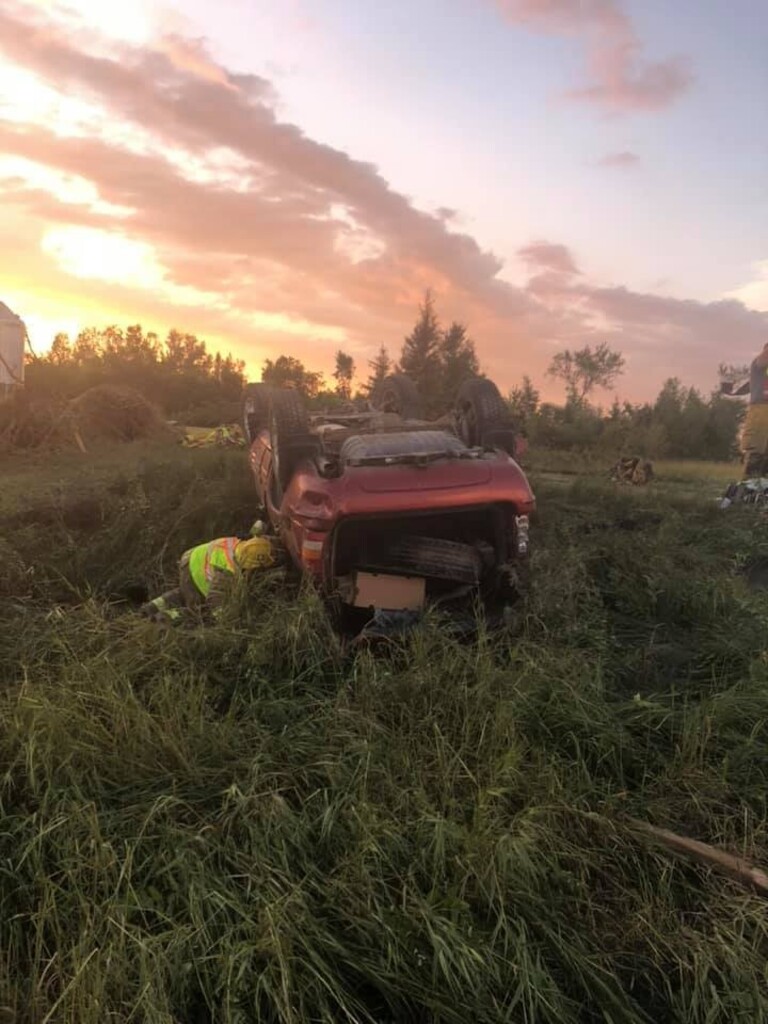 CP
A first responder checks on an overturned Jeep Grand Cherokee at the scene where a tornado touched down, uprooting trees and overturning two vehicles near Virden, Man., on Friday. THE CANADIAN PRESS/HO-Wallace District Fire Department.