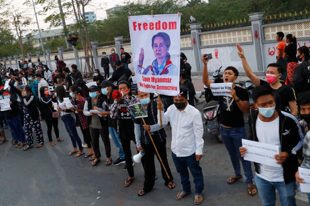 Protesters hold an image of deposed leader Aung San Suu Kyi in Mandalay, Myanmar, on Monday. (The Associated Press)