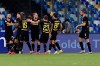 Inter Milan's Christian Eriksen, 5th from right, celebrates with teammates after scoring his side's opening goal during the Italian Cup second leg semifinal soccer match between Napoli and Inter Milan, at the Naples San Paolo Stadium, Italy, Saturday, June 13, 2020. The match is being played without spectators because of the COVID-19 restriction measures. (Cafaro/LaPresse via AP)