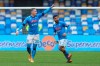 Napoli's Piotr Zielinsk, left, celebrates with his teammate Lorenzo Insigne after scoring his side's fourth goal during the serie A soccer match between Napoli and Fiorentina at the Diego Armando Maradona stadium in Naples, Italy, Sunday, Jan. 17, 2021. (Alessandro Garofalo/LaPresse via AP)