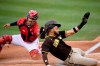 San Diego Padres' Fernando Tatis Jr., right, slides home safely to score against Washington Nationals catcher Rene Rivera on a sacrifice fly by Manny Machado during the first inning of a baseball game Saturday, July 17, 2021, in Washington. (AP Photo/Nick Wass)