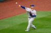 New York Mets starting pitcher Rick Porcello tosses the ball before a baseball game against the Washington Nationals, Friday, Sept. 25, 2020, in Washington. The game was postponed due to inclement weather. (AP Photo/Nick Wass)