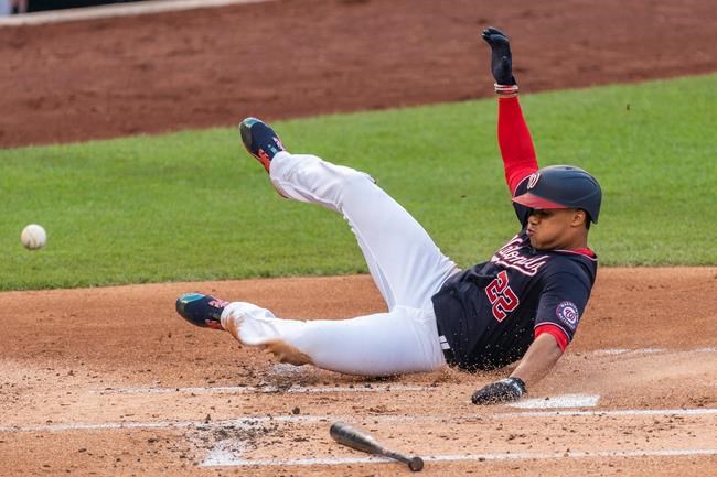 Washington Nationals Juan Soto scores during the first inning of the team's baseball game against the Atlanta Braves in Washington, Friday, Sept. 11, 2020. (AP Photo/Manuel Balce Ceneta)