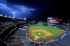 A bolt of lightning comes down from the clouds during the sixth inning of an opening day baseball game between the Washington Nationals and the New York Yankees at Nationals Park, Thursday, July 23, 2020, in Washington. (AP Photo/Alex Brandon)