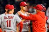 St Louis Cardinals pitching coach Mike Maddux, right, talks with starting pitcher Jack Flaherty, center, during the fourth inning of a baseball game against the Washington Nationals at Nationals Park, Monday, April 19, 2021, in Washington. (AP Photo/Alex Brandon)