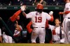 Washington Nationals' Josh Bell (19) returns to the dugout after hitting a home run during the sixth inning of the team's baseball game against the St. Louis Cardinals, Tuesday, April 20, 2021, in Washington. (AP Photo/Nick Wass)