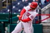 Washington Nationals' Juan Soto hits a sacrifice fly during the fourth inning of a baseball game against the Arizona Diamondbacks at Nationals Park, Saturday, April 17, 2021, in Washington. (AP Photo/Alex Brandon)