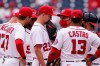 Washington Nationals relief pitcher Erick Fedde (23) talks with pitching coach Jim Hickey, third from right, and others during the fifth inning of a baseball game against the Arizona Diamondbacks at Nationals Park, Saturday, April 17, 2021, in Washington. (AP Photo/Alex Brandon)