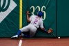 New York Mets' Dominic Smith smashes into the outfield wall while chasing a fly ball that went for an inside-the-park home run by Washington Nationals' Andrew Stevenson during the fifth inning of the first baseball game of a doubleheader, Saturday, Sept. 26, 2020, in Washington. The game is a makeup from Sept. 25. (AP Photo/Nick Wass)
