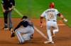 Washington Nationals' Asdrubal Cabrera (13) is safe at first as Atlanta Braves first baseman Freddie Freeman (5) misses a catch during the ninth inning of a baseball game in Washington, Thursday, Sept. 10, 2020. (AP Photo/Manuel Balce Ceneta)