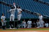New York Yankees' Giancarlo Stanton (27) jumps to celebrate his two-run homer with Aaron Judge during the first inning of an opening day baseball game against the Washington Nationals at Nationals Park, Thursday, July 23, 2020, in Washington. (AP Photo/Alex Brandon)