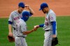 New York Mets relief pitcher Dellin Betances (68) is pulled by manager Luis Rojas, front left, during the sixth inning of a baseball game against the Washington Nationals, Sunday, Sept. 27, 2020, in Washington. Mets third baseman Todd Frazier, back left, looks on. (AP Photo/Nick Wass)