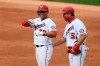 Washington Nationals' Juan Soto, left, reacts at first after his single during the second inning of a baseball game against the New York Mets, Sunday, Sept. 27, 2020, in Washington. Nationals first base coach Bob Henley, right, looks on. (AP Photo/Nick Wass)