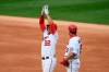 Washington Nationals' Juan Soto (22) reacts at first after his single during the second inning of a baseball game against the New York Mets, Sunday, Sept. 27, 2020, in Washington. Also seen is Nationals first base coach Bob Henley at right. The Nationals won 15-5. (AP Photo/Nick Wass)