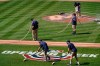 Groundskeepers prepare the field before a home opener baseball game between the Atlanta Braves and the Washington Nationals at Nationals Park, Tuesday, April 6, 2021, in Washington. (AP Photo/Alex Brandon)