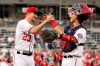 FILE - In this Sept. 29, 2019 file photo, Washington Nationals relief pitcher Erick Fedde (23) and catcher Tres Barrera (73) celebrate after defeating the Cleveland Indians in a baseball game at Nationals Park, in Washington. Barrera was suspended 80 games without pay by Major League Baseball on Saturday, July 25, 2020, after testing positive for an anabolic steroid. (AP Photo/Andrew Harnik)