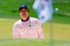 Kyoung-Hoon Lee watches his shot on the 15th hole during the first round of the Wells Fargo Championship golf tournament at Quail Hollow Club on Thursday, May 6, 2021, in Charlotte, N.C. (AP Photo/Jacob Kupferman)