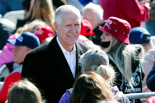 Sen. Thom Tillis, R-N.C., speaks to supporters before President Donald Trump arrives to speak at a campaign rally in Fayetteville, N.C., Monday, Nov. 2, 2020. (AP Photo/Karl DeBlaker)