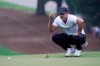 Brooks Koepka lines up a putt on the 11th hole during the first round of the Wyndham Championship golf tournament at Sedgefield Country Club on Thursday, Aug. 13, 2020, in Greensboro, N.C. (AP Photo/Chris Carlson)