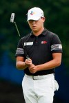 Si Woo Kim, of South Korea, lines up a putt on the first hole during the third round of the Wyndham Championship golf tournament at Sedgefield Country Club on Saturday, Aug. 15, 2020, in Greensboro, N.C. (AP Photo/Chris Carlson)