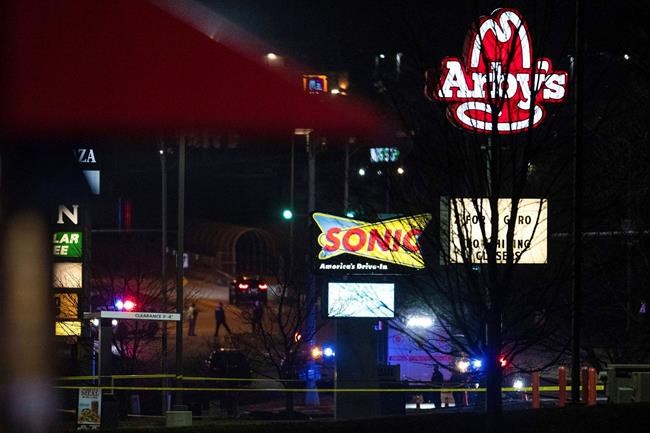 This Sunday, Nov. 22, 2020 photo shows emergency personnel on the scene after a shooting at a Sonic restaurant on Saturday night where two people were killed and two others wounded in Bellevue, Neb. (Anna Reed/Omaha World-Herald via AP)